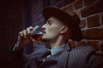 man drinks whiskey
