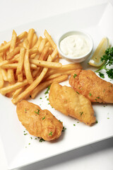 british traditional fish and chips meal on plate