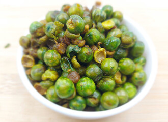 Fried green peas in a bowl