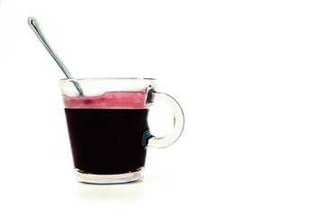 Coffee cup with spoon inside on white background with copy space.