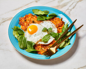 winter squash latke with Fried Eggs and Greens