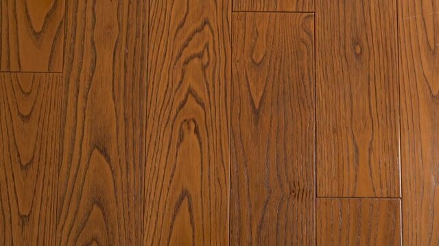 Natural Wood Texture of American Walnut in Brown Tones, Natural Walnut Floors, Board, Parquet, Solid Wood for Finishing. Background of Walnut Wood in Brown Tones, Close-up.