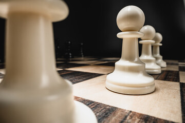 Chess figures on chess board macro photo