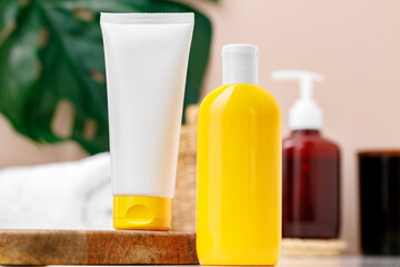 Sunscreen cosmetic containers in bathroom close up