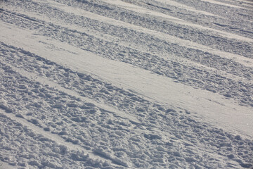 Groomed surface of mountain valley in French Alps