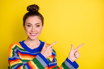 Portrait of nice lady indicate two hands fingers empty space wear nice sweater isolated on yellow color background