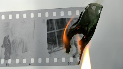 Burning Negative Plastic Film Strip with a Lighter