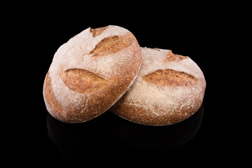 Freshly baked homemade bread isolated on black. Fresh rye bread. Healthy eating and traditional bakery, baking bread concept