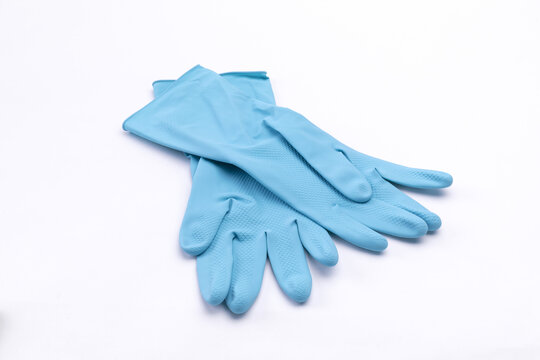 An isolated closeup of blue rubber gloves on a white background