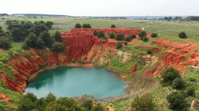 Lago di Bauxite, Italy. Fascinating natural landscape of charming Puglia region. The intense emerald color lake is the peculiarity of the Bauxite Cave of Otranto. High quality 4k footage