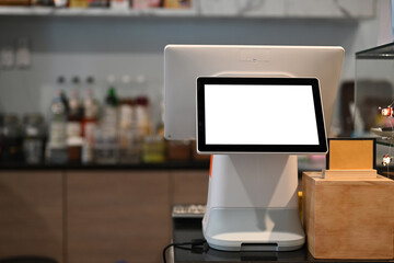 A touchscreen cashier machine with blank screen at modern coffee shop. - obrazy, fototapety, plakaty