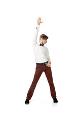 Dancer. Happy young man dancing in casual clothes or suit, remaking legendary moves and dances of celebrity from culture history. Isolated on white. Action, motion, fame concept. Creative occupation.