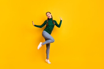 Fototapeta na wymiar Full length body size photo female student laughing dancing at party isolated on vivid yellow color background