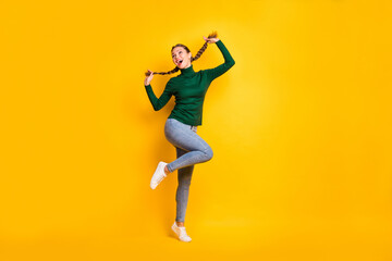 Fototapeta na wymiar Full length body size photo female student laughing dancing cheerful enjoying isolated on vibrant yellow color background