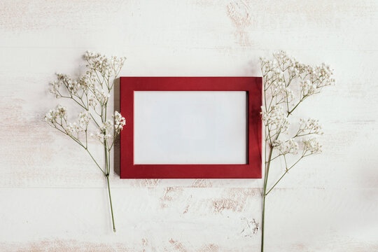 red frame with white flowers