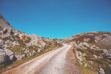 Car driving on a mountain winding road. The road from glacial lake Enol to lake Ercina. National Park Peaks of Europe (Picos de Europa). Asturias, Spain, Europe