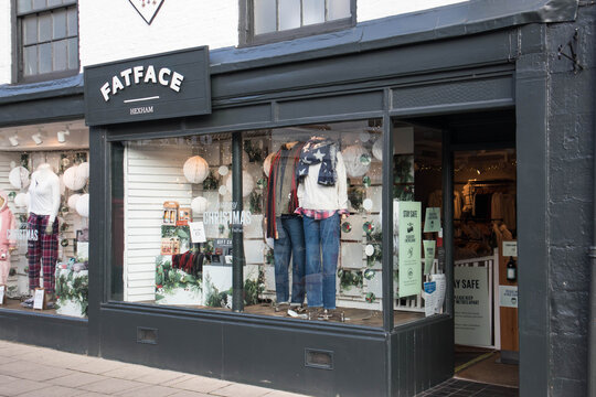 Exterior Of Fat Face Fashion Clothing Store Shop In A High Street Location Showing Window Display, Entrane, Company Logo And Branding.