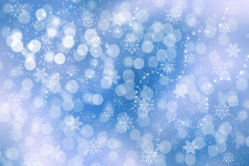 Abstract blurred festive light blue pink winter christmas or Happy New Year background with shiny blue and white bokeh lighted snowflakes and stars. Space for your design. Card concept.