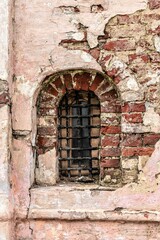 Fototapeta na wymiar Russia, Rostov, July 2020. Semicircular window in the old fortress wall.