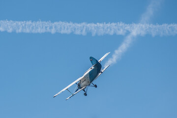 biplane Antonov An-2 in the sky fighting against the fire in Czech Republic near hill Ještěd