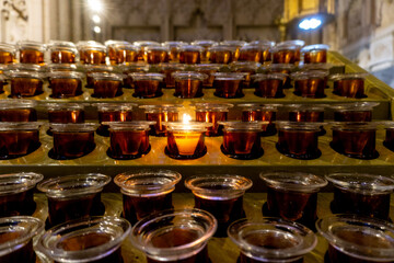 A bright candle around candles