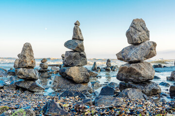 Stability nature meditation background. Calm water and stone balance zen tower. Nature photography