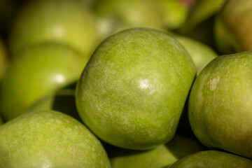 Green apples for sale at the city market