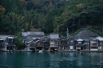 Fototapeta na wymiar View of Funaya, boat houses, at Ine bay in Autumn , Ine city, Kyoto, Japan - 京都 伊根の舟屋