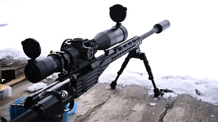A top look at a Russian-made sniper rifle in the winter. 9.6 x 53 mm Lancaster VPO-223