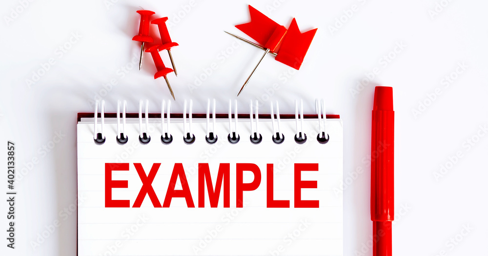Poster the word example is written in the notebook with office tools .