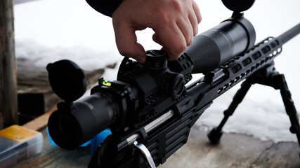 Adjusting the telescopic sight on the optics of a bolt rifle caliber 9.6 x 53 mm Lancaster
