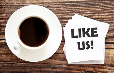 Business LIKE US . White stickers with text on the wooden background with coffee