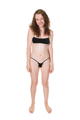 Portrait of a beautiful laughing woman wearing a black micro bikini, isolated on white studio...