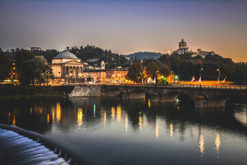 Night view of the Po river in the center of Turin, Italy