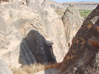 Amazing majesty and beauty of snow-white impregnable rocks on a background of clear blue sky.