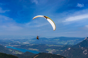 paraglinding in upper austria. St Gilgen and Wolfgangsee lake on the background. Active sport base in Zwolferhorn hill.