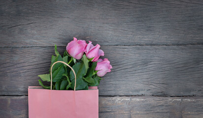 paper bag and pink roses