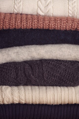 stack of multicolored woolen folded sweaters