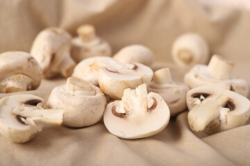 fresh champignons on linen fabric