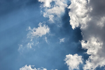 Cloudy sky with a sun rays
