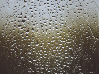 Water droplets on a window on a rainy day.