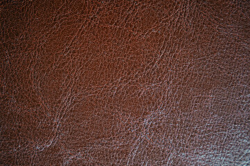 Close up of brown leather texture. Grunge skin fabric background.