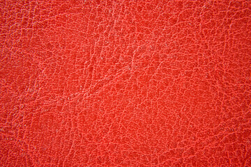 Close up of orange leather texture. Grunge skin fabric background.