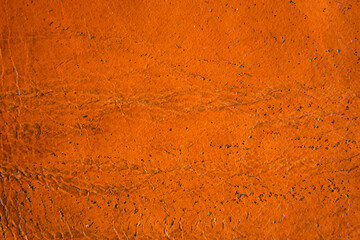 Close up of brown leather texture. Grunge skin fabric background.
