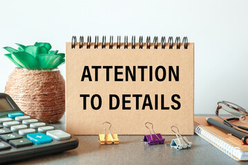 ATTENTION TO DETAILS - an inscription on a card near office supplies
