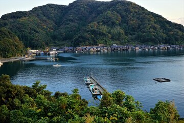 Aerial View of Ine bay and Funaya, boat houses, with beautiful sunset from Observation deck in Autumn, Ine city, Kyoto, Japan - 日本 京都 伊根湾の舟屋
