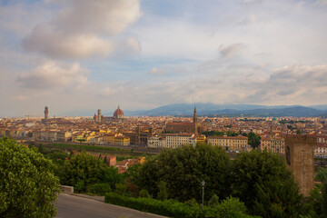 Fototapeta na wymiar Cityscape of Florence, Italy, seen from Piazzale Michelangelo, on a cloudy, summer morning. 