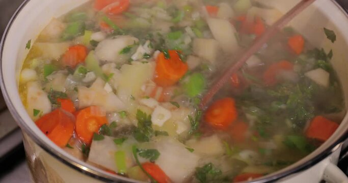 Cooking vegetable soup with many frash ingredients