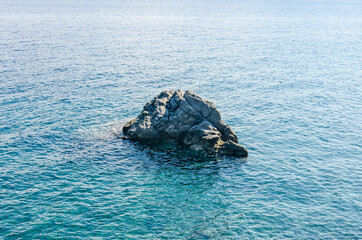 Landscape view of Aegean Sea and beautiful mountainous islands with cliff at foreground against cloudy blue sky on sunny summer day from Datca