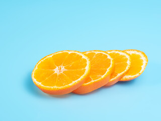 Orange tangerine slice on blue background